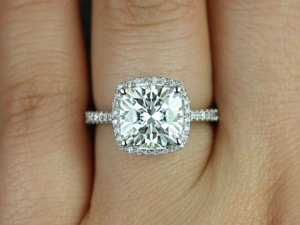 An engagement ring is worn on which hand